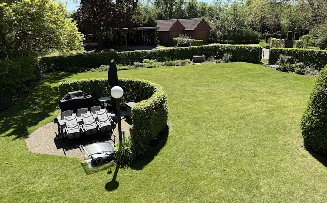 Compact robotic lawn mower for a small garden